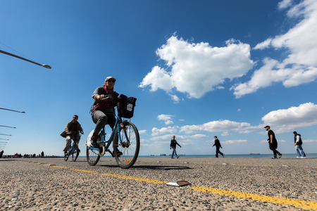 Thessaloniki, Greece - April 9, 2017: People enjoy a walk on the new park and the waterfront of the city of Thessaloniki during the dayのeditorial素材