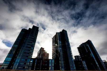 Reykjavik, Iceland - April 1, 2017: Modern buildings just before storm with dramatic clouds in Reykjavik capital city of Icelandのeditorial素材