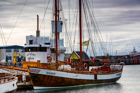 Husavik, Iceland - March 29, 2017: Traditional whale watching boats lying in the harbor of Husavik , northern coast of Icelandのeditorial素材