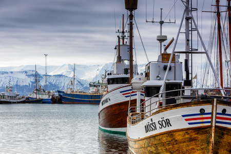 Husavik, Iceland - March 29, 2017: Traditional whale watching boats lying in the harbor of Husavik , northern coast of Icelandのeditorial素材