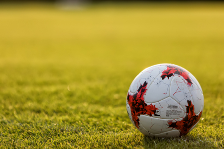 Thessaloniki, Greece- August 12, 2017: Football balls on the pitch during the training in the sunsetのeditorial素材