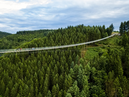 aerial view Germany's longest rope suspension bridge 300 feet above a canyon floor Geierley. It is between the towns of Morsdorf and Sosbergの写真素材