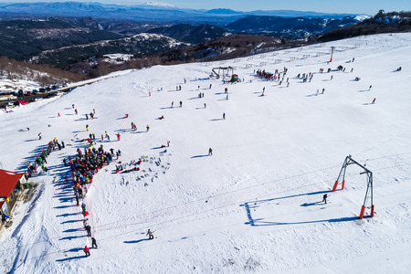 Aerial View of skiers at Ski Resort Vasilitsa in the mountain range of Pindos, in Greece.のeditorial素材