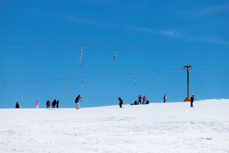 Vasilitsa, Greece - January 5, 2018: Skiers enjoy the snow at Ski Resort Vasilitsa in the mountain range of Pindos, in Greece. The ski resorts currently has 5 lifts and 16 ski trailsのeditorial素材