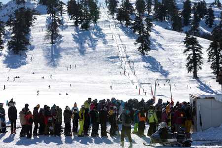 Vasilitsa, Greece - January 5, 2018: Skiers enjoy the snow at Ski Resort Vasilitsa in the mountain range of Pindos, in Greece. The ski resorts currently has 5 lifts and 16 ski trailsのeditorial素材