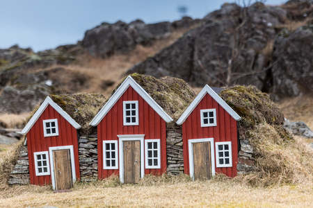 Traditional Icelandic Turf Houses. A row of traditional Icelandic houses with the roofs covered in turf for insulation. の写真素材
