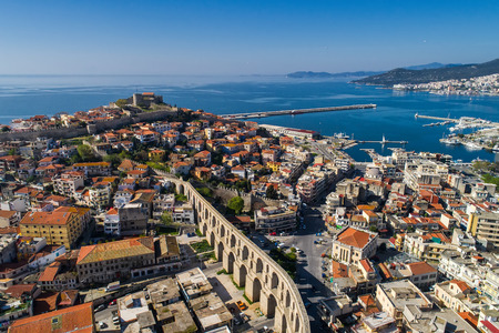 Kavala, Greece - April 9,2018: Aerial view the city of Kavala in northern Greek, ancient aqueduct Kamares, homes and medieval city wallのeditorial素材