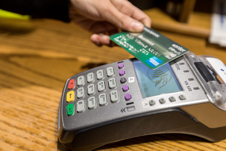 Thessaloniki, Greece - January 19, 2018: Closeup of American Express Credit card payment, buy and sell products & service on the EDC machine.のeditorial素材