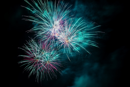 Colorful fireworks of various colors over night sky
