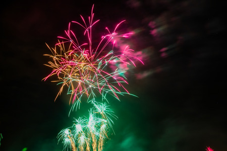 Colorful fireworks of various colors over night skyの写真素材