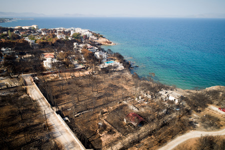 Mati, Athens - July 26, 2018: Aerial view shows a burnt area following a wildfire in the village of Mati, near Athens. Wildfires occurred on the 23 of July , left for the moment 92 people dead.のeditorial素材