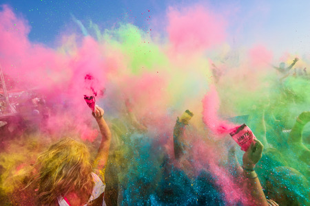 Thessaloniki, Greece - September 2, 2018: Crowds of unidentified people throw colour powder during...