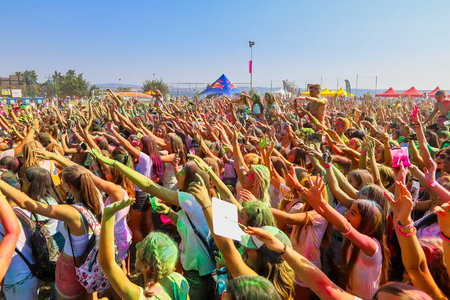 Thessaloniki, Greece - September 2, 2018: Crowds of unidentified people throw colour powder during the "Day of Colours" annual event.のeditorial素材