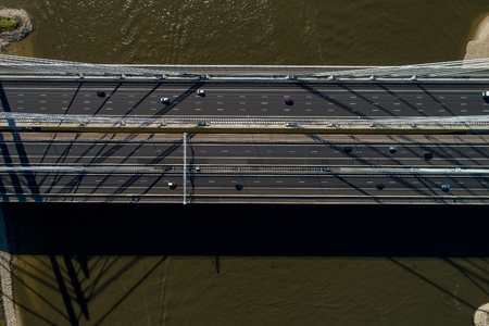 Aerial view of the bridge and the road with cars over the river Rhine in an area of the Netherlands
