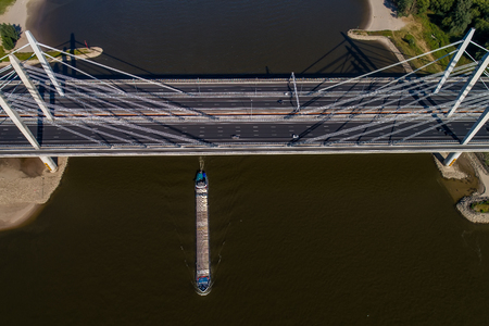 Aerial view of the bridge and the road with cars over the river Rhine in an area of the Netherlandsの写真素材