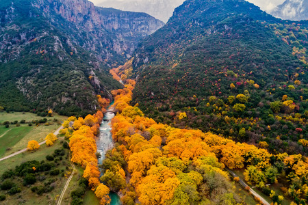 Aerial view of the Old stone bridge in Klidonia Zagoria in the autumn, Epirus, Western Greece. This arch bridge with elongated arch built in 1853.の写真素材