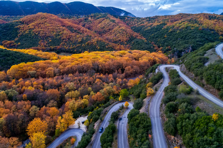 Aerial view of the the Vikos Gorge in the autumn and provincial road with many zigzag in the Epirus Zagorohoria, Greece. National parkの写真素材
