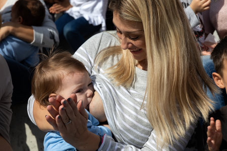 Thessaloniki, Greece - November 4, 2018: Mother breastfeeding her baby on the 9th Nationwide public breastfeeding in celebration of World Breastfeeding Weekのeditorial素材