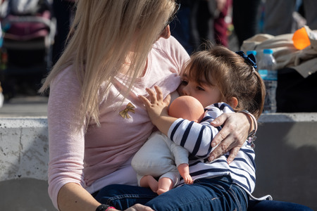 Thessaloniki, Greece - November 4, 2018: Mother breastfeeding her baby on the 9th Nationwide public breastfeeding in celebration of World Breastfeeding Weekのeditorial素材