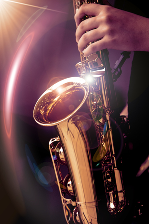 Jazz saxophone player in performance on the stage. color filter and Light filter.の写真素材