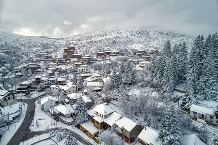 Aerial View of Seli Traditional Greek Village Covered by Snow in Winter Morning. Top Tourist Destination in Northern Greeceの写真素材