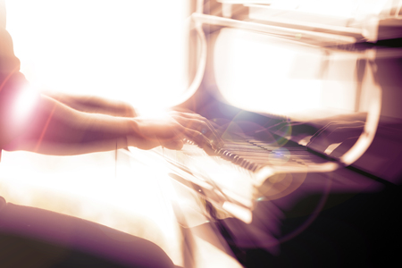 Close-up musician playing the piano on the stage. color filter and Light filter.の写真素材