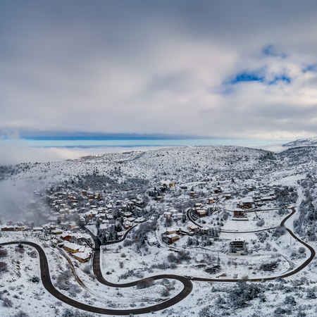Aerial View of Seli Traditional Greek Village Covered by Snow in Winter Morning. Top Tourist Destination in Northern Greeceの写真素材