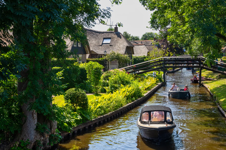 Giethoorn, Netherlands - July 4, 2018: view of famous village Giethoorn with canals in the Netherlands. Giethoorn is also called 'Venice of The Netherlands'のeditorial素材