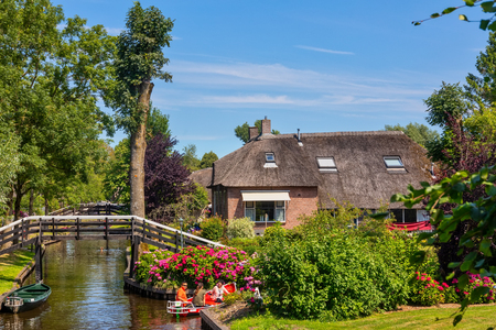 Giethoorn, Netherlands - July 4, 2018: view of famous village Giethoorn with canals in the Netherlands. Giethoorn is also called 'Venice of The Netherlands'のeditorial素材