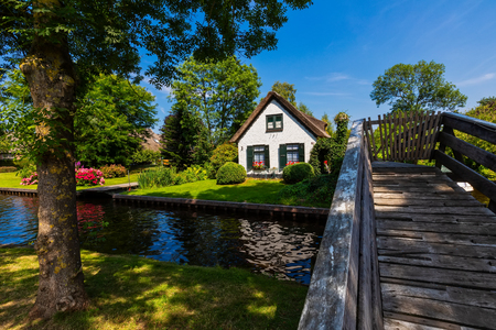 Giethoorn, Netherlands - July 4, 2018: view of famous village Giethoorn with canals in the Netherlands. Giethoorn is also called 'Venice of The Netherlands'のeditorial素材