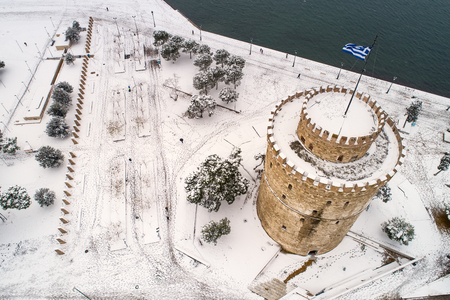 Thessaloniki, Greece - January 5, 2019: Aerial view of the snowy famous white tower in the city of Thessaloniki in northern Greece.のeditorial素材