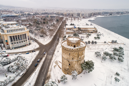 Thessaloniki, Greece - January 5, 2019: Aerial view of the snowy famous white tower in the city of Thessaloniki in northern Greece.のeditorial素材