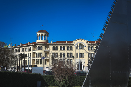 Thessaloniki, Greece - February 14, 2019: The sculpture "saw" by Andrei Filippov and the building X.A.N. Thessaloniki and which comprises the homonymous Greek multi-sport clubのeditorial素材