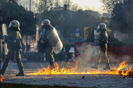 Thessaloniki, Greece - Dec 6, 2018:petrol bomb explodes among riot policemen during clashes...