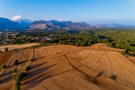 Beautiful rural scenery in mountains. agricultural fields with sheep. Aerial shot whith droneの写真素材