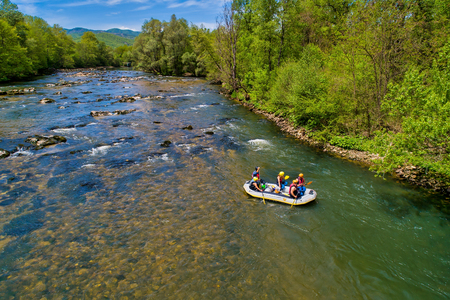 Paranesti, Drama, Greece - May 1, 2019: Aerial view of adventure team doing rafting on the cold waters of the Nestos River in Paranesti. Nestos river is one of the most popular among rafters in Greeceのeditorial素材