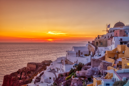 Oia village in Santorini island at sunset in Greeceの写真素材