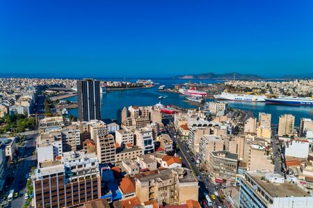 Piraeus, Greece - May 30, 2019: Aerial drone panoramic photo of Piraeus and the famous port in...