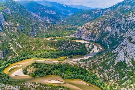 Aerial view of the river Nestos in Xanthi, Greece. The Nestos River forms on its long journey landscapes of unique beauty with rich forests, rare wetlands. favorite destination for canoe and kayakの写真素材