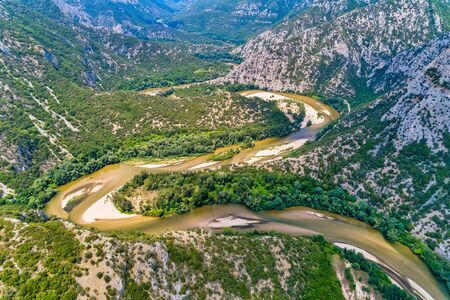 Aerial view of the river Nestos in Xanthi, Greece. The Nestos River forms on its long journey landscapes of unique beauty with rich forests, rare wetlands. favorite destination for canoe and kayakの写真素材