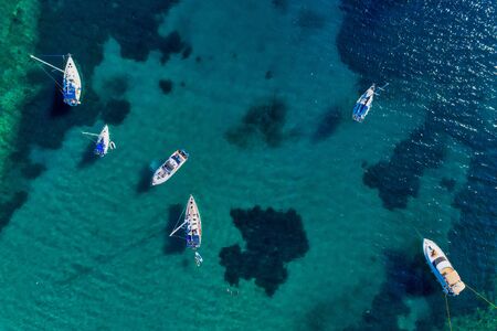 Aerial view of sail boats in front of Aliki beach at Thassos island, Greece. Amazing beach with a...