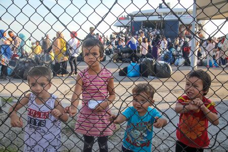 Thessaloniki, Greece â Sept 2, 2019: Refugee children disembark in the port of Thessaloniki after being transfered from the refugee camp of Moria, Lesvos islandのeditorial素材