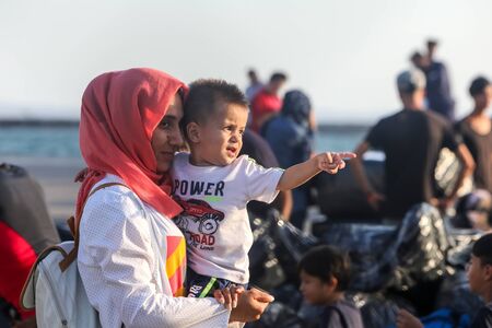 Thessaloniki, Greece â Sept 2, 2019: Refugees and migrants disembark to the port of Thessaloniki after being transfered from the refugee camp of Moria, Lesvos island.のeditorial素材