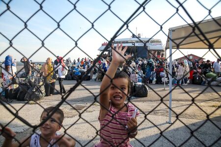 Thessaloniki, Greece â Sept 2, 2019: Refugee children disembark in the port of Thessaloniki after being transfered from the refugee camp of Moria, Lesvos islandのeditorial素材