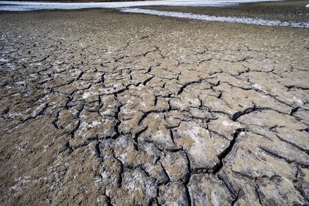 Dry lake bed with natural texture of cracked clay in perspective floor. Death Valley field ....