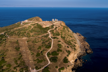 Aerial view over the ancient Temple of Poseidon at Cape Sounio, Attica, Greeceのeditorial素材