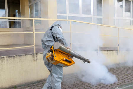 Thessaloniki, Greece - Feb 28, 2020: Workers sprays disinfectant as part of preventive measures...