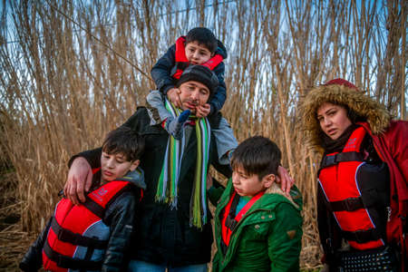 Lesbos, Greece, March 2, 2020: Refugees and Migrants aboard reach the Greek Island of Lesbos after crossing on a dinghy the Aegean sea from Turkeyのeditorial素材