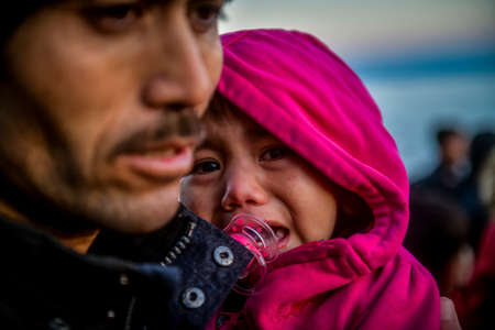 Lesbos, Greece, March 2, 2020: Refugees and Migrants aboard reach the Greek Island of Lesbos after crossing on a dinghy the Aegean sea from Turkeyのeditorial素材