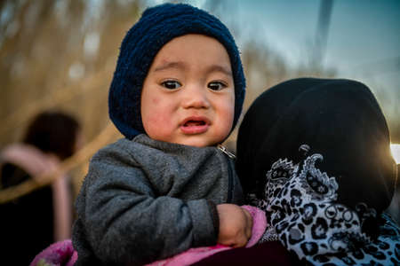 Lesbos, Greece, March 2, 2020: Refugees and Migrants aboard reach the Greek Island of Lesbos after crossing on a dinghy the Aegean sea from Turkeyのeditorial素材